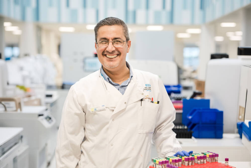 A biomedical scientist smiling